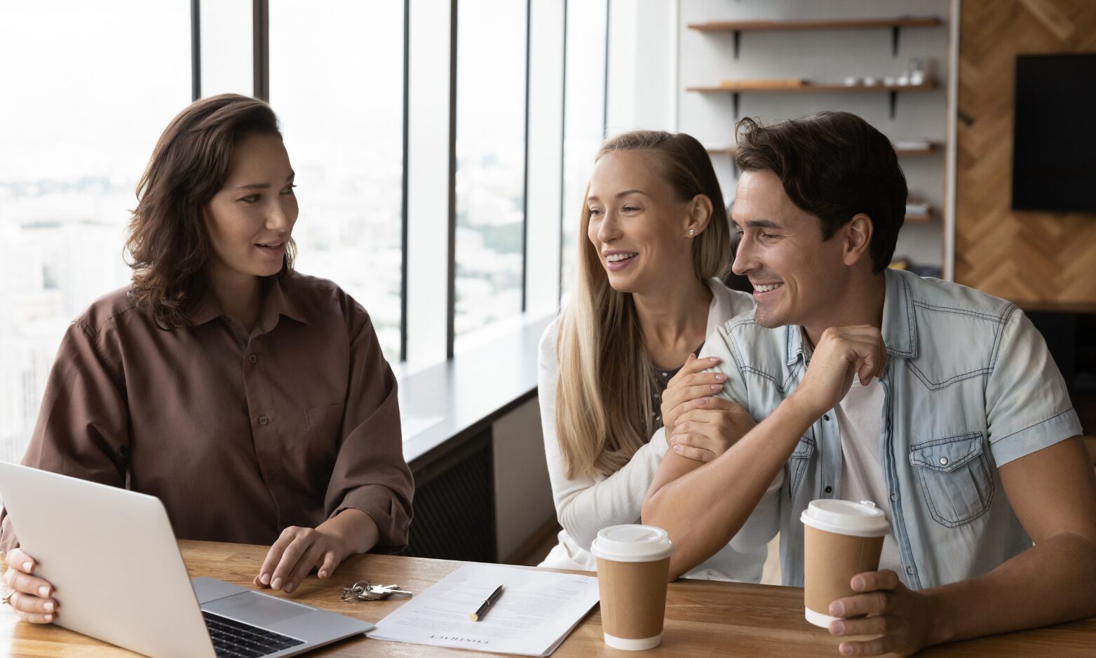 A letting agent discussing a rental property with prospective tenants during a meeting in Annan.