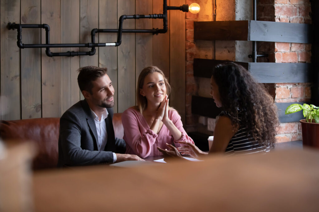 A landlord or letting agent meeting with prospective tenants to discuss a rental property in Stourbridge.