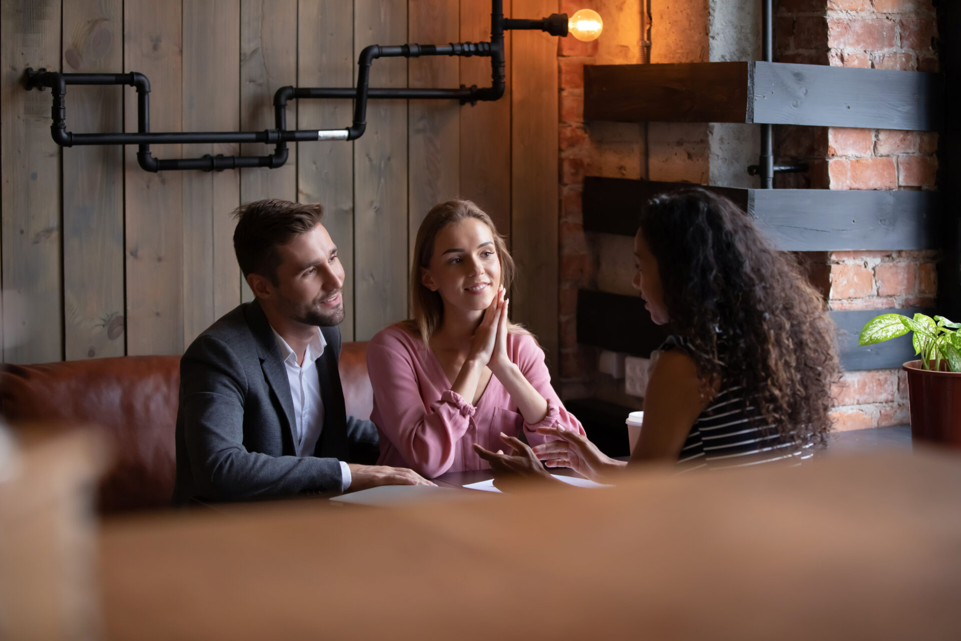 A landlord or letting agent meeting with prospective tenants to discuss a rental property in Stourbridge.