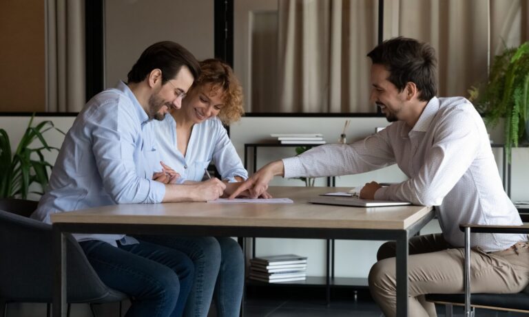 A letting agent meeting with prospective landlords to discuss renting out a property in Lichfield.