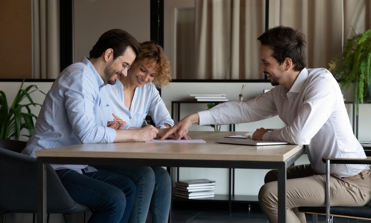 A letting agent meeting with prospective landlords to discuss renting out a property in Lichfield.