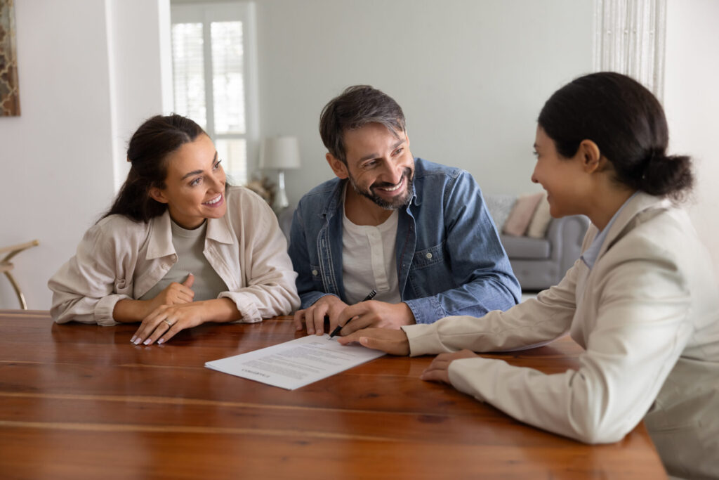 Homeowners discussing a property valuation with an estate agent in Chesterfield.