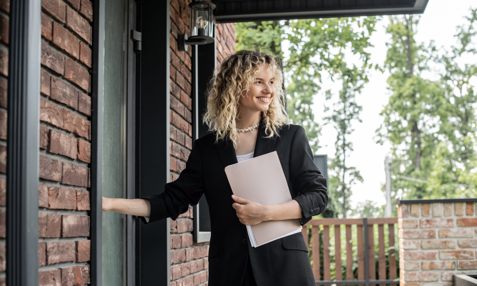 Property professional arriving at a home to help homeowners with selling and downsizing in Annan.