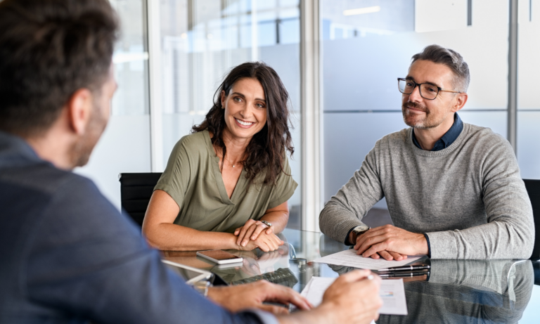 Property owners discussing their rental investment with a letting agent