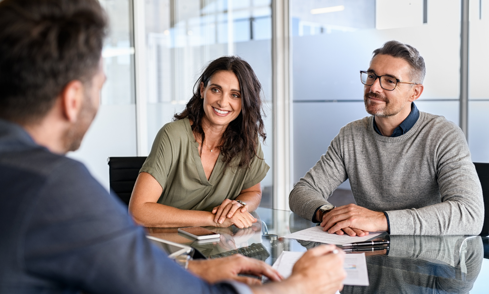 Property owners discussing their rental investment with a letting agent