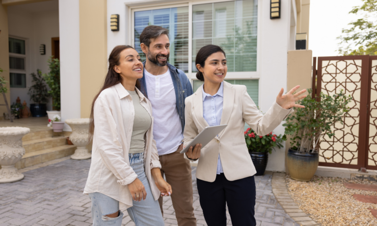 Couple viewing a rental property with a letting agent in Manchester.