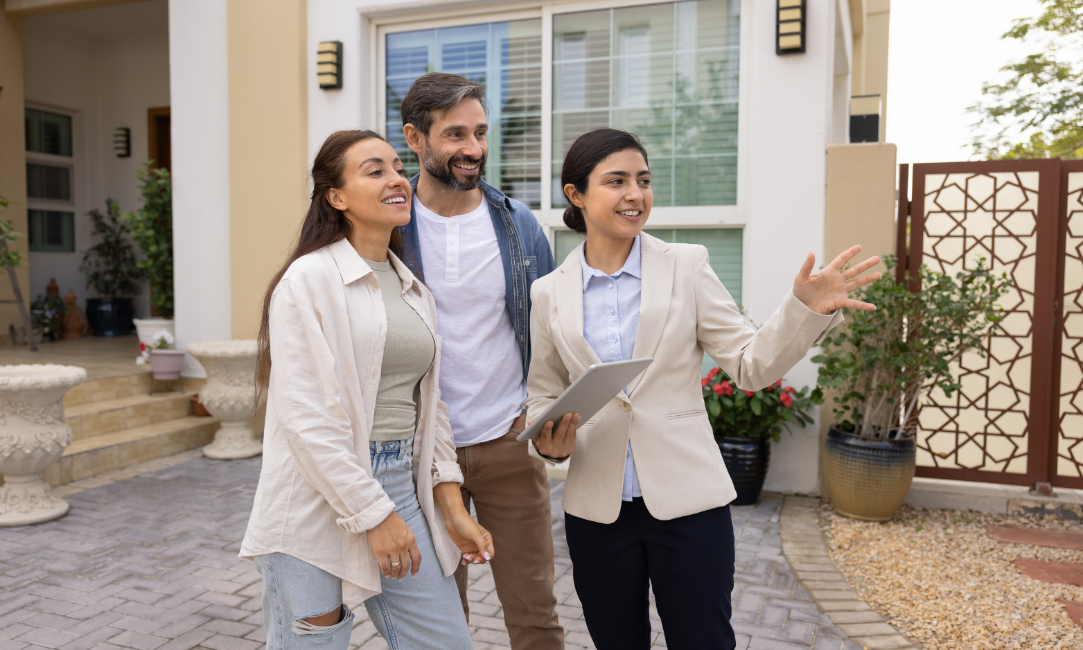 Couple viewing a rental property with a letting agent in Manchester.