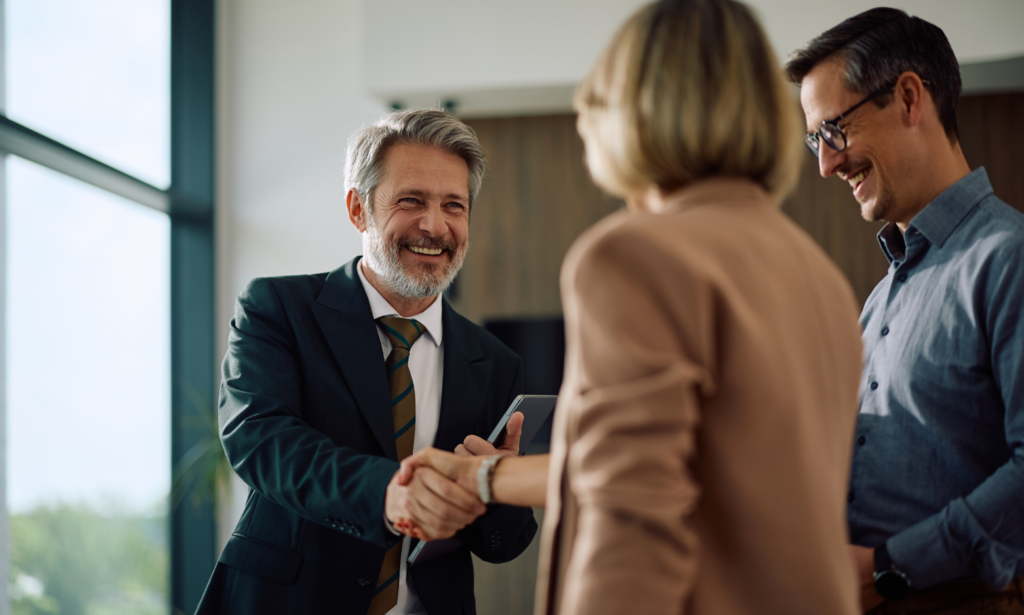 Landlord couple discussing their rental property with an estate agent