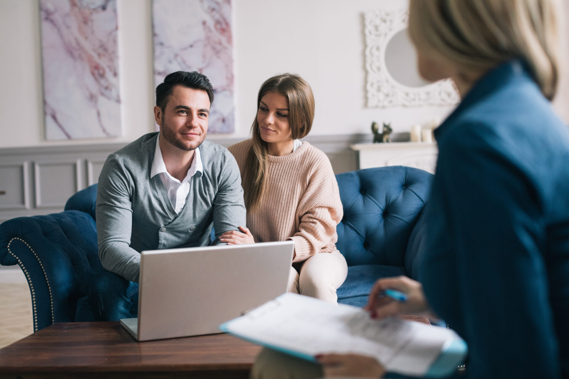 Couple discussing a rental property with a letting agent in Dumfries