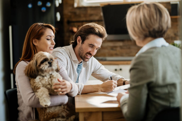 Couple meeting with an estate agent to discuss selling their Harborne home.