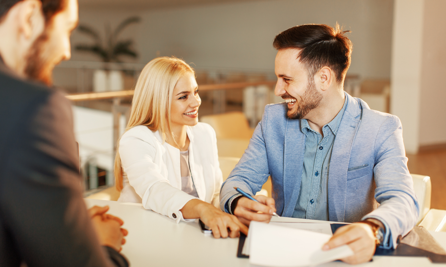 Homeowners discussing their property with an estate agent ahead of selling their home in Solihull.