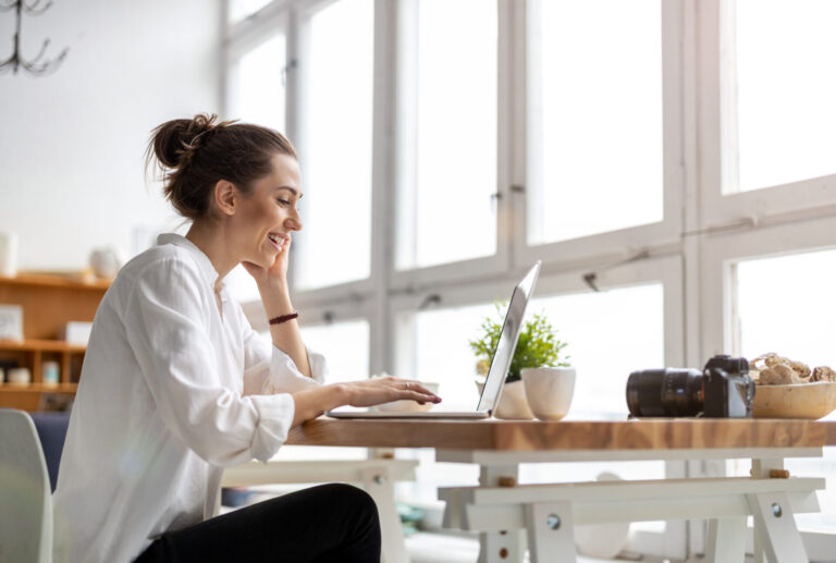 Homebuyer researching the Stourbridge property market on a laptop before purchasing a home.