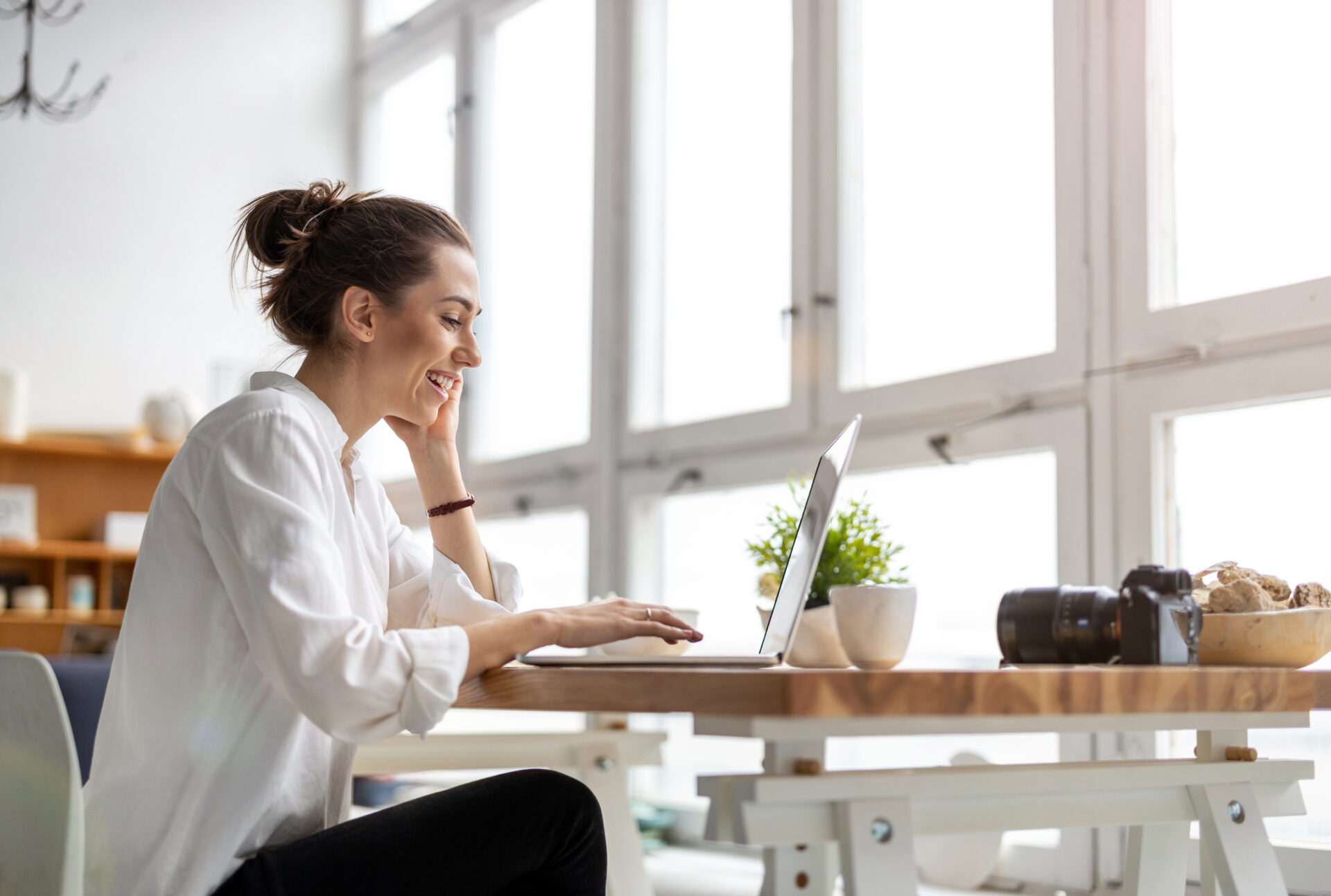 Homebuyer researching the Stourbridge property market on a laptop before purchasing a home.
