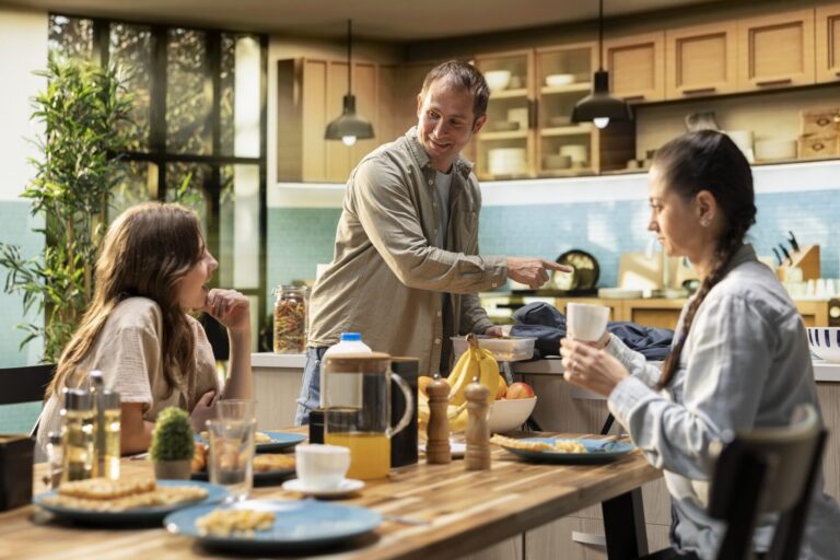 Tenant family having breakfast together in the kitchen of a rented home in Dumfries
