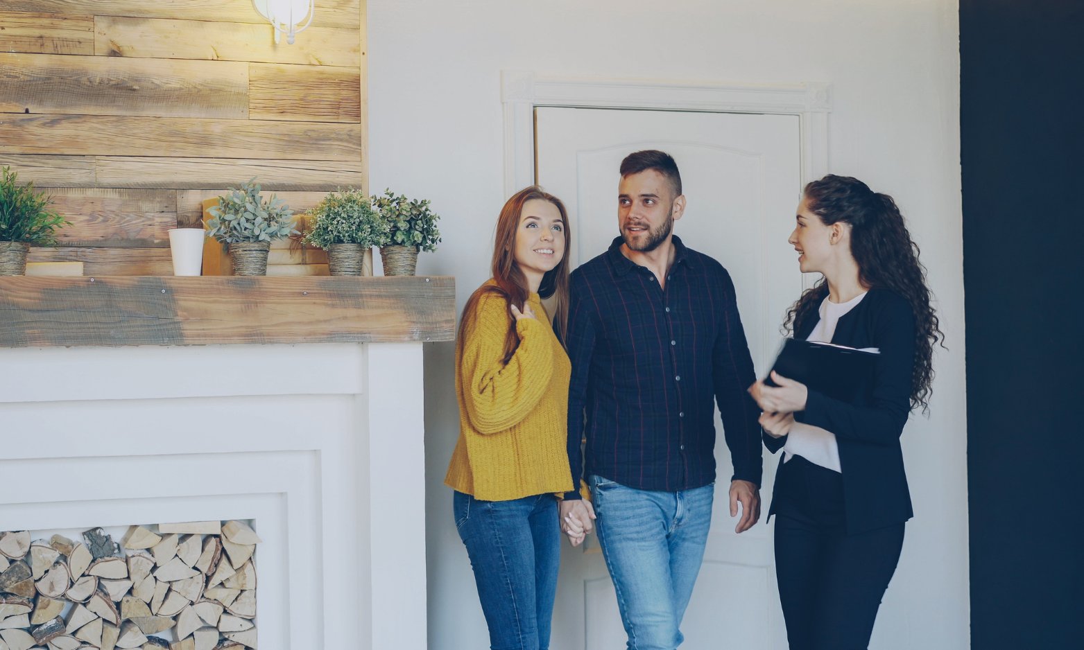 Hunters Exeter letting agent talking through a tenancy with a couple inside a bright rental home